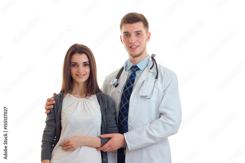 beautiful young girl stands next to doctor and smiling beautiful young girl stands next to doctor and smiling