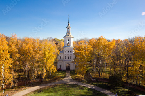 Gate belltower, entrance to the estate of Bobrinsky Counts at autumn trees