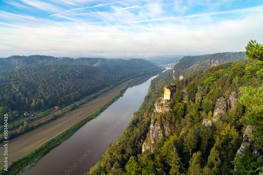 View from the Bastai mountain on Elbe river and the town of Rathen at sunrise, Saxony, Germany View from the Bastai mountain on Elbe river and the town of Rathen at sunrise, Saxony, Germany