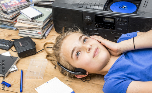 Nineties music header. Girl listening to walkman and radio photo