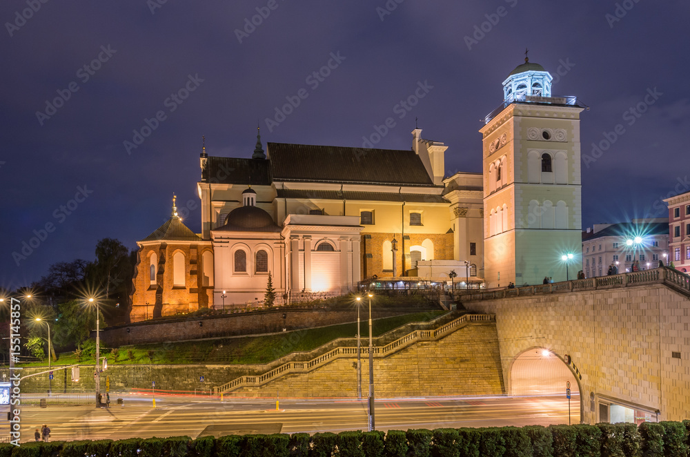 Warsaw, Poland, St Anne church over street and tunnel entrance