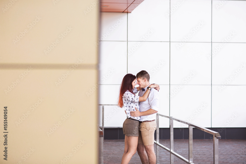 Couple in love embracing on street of city Couple in love embracing on street of city