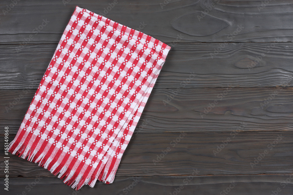 red cloth on dark wooden background with copy space. Top view. red cloth on dark wooden background with copy space. Top view.
