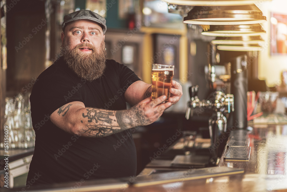 Bartender at counter in a pub