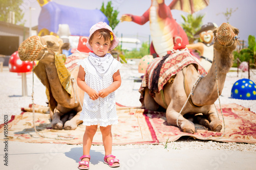 the little girl with camels photo