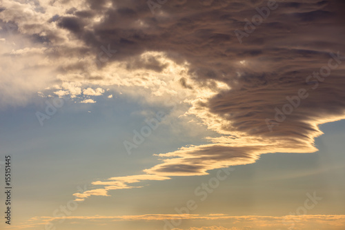 Clouds on a blue sky background at sunset © Rawf8