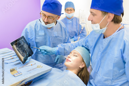 Dental Team Examining Radiography photo