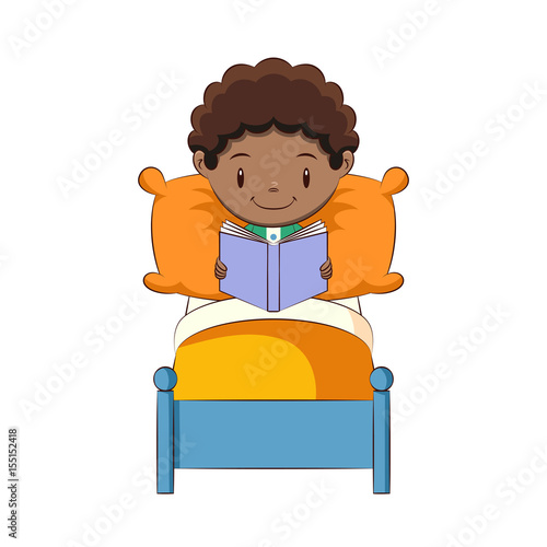 Boy reading book in bed
