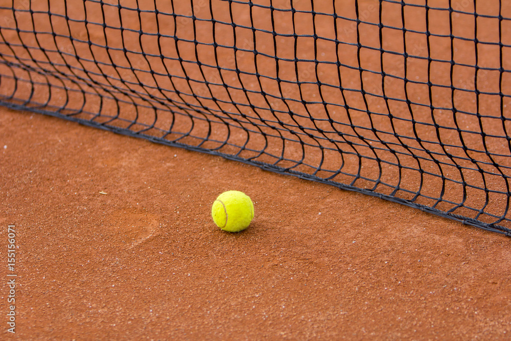 Tennis court with tennis ball and net