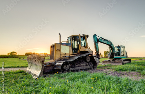 The excavator and bulldozer.