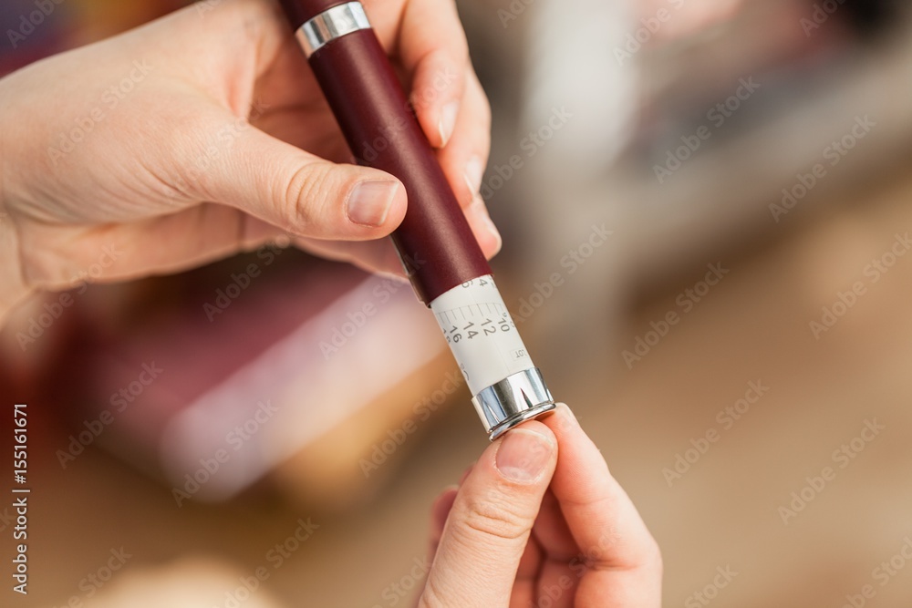 Woman hands using lancet. Woman hands using lancet.