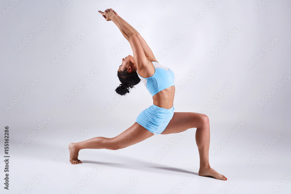 Woman doing yoga isolated on white background