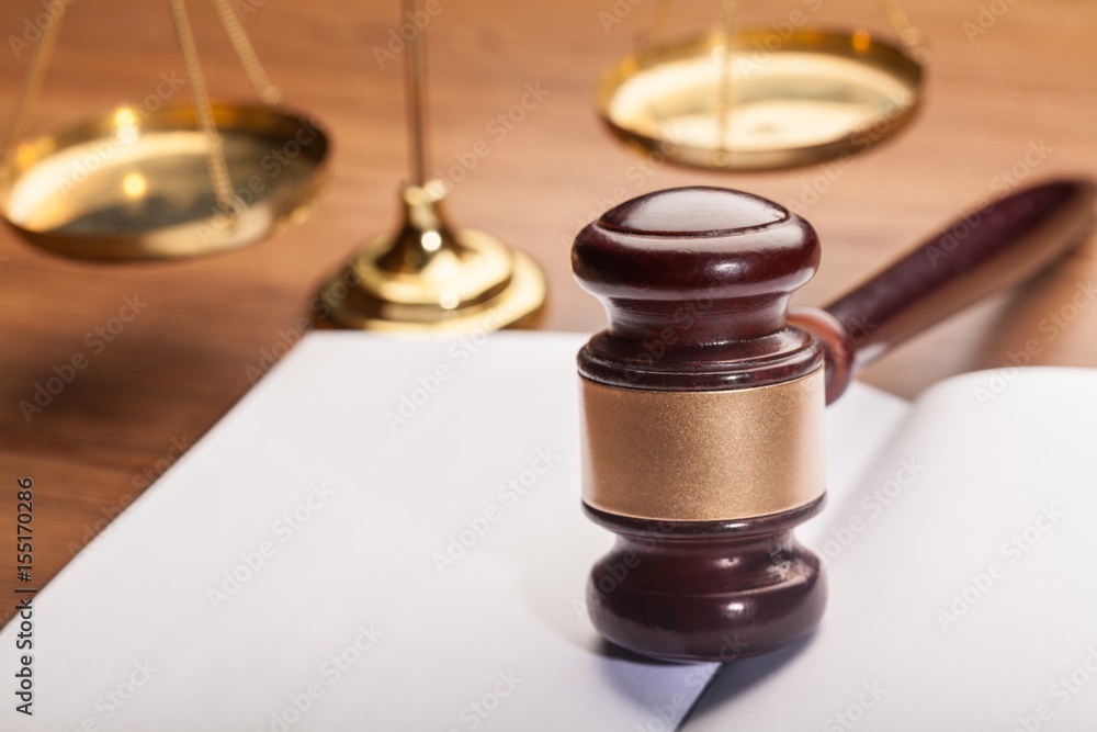 Wooden gavel on book. Wooden gavel on book.
