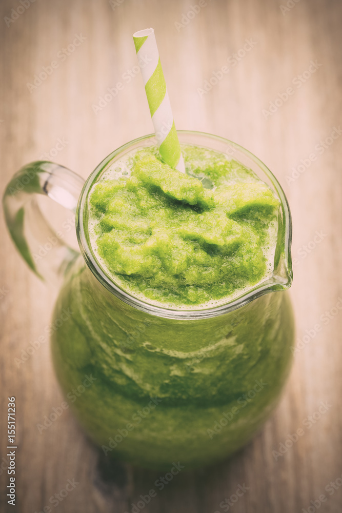 Rucola smoothie, on the grey background. Rucola smoothie, on the grey background.