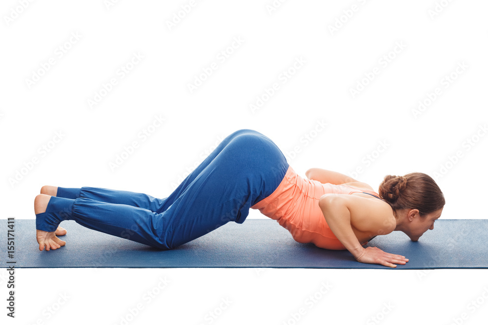 Woman doing yoga asana Ashtangasana isolated on white Woman doing yoga asana Ashtangasana isolated on white