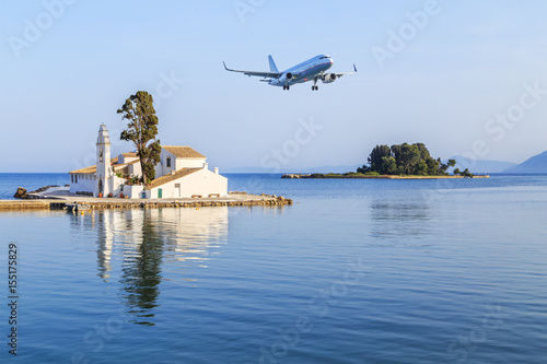 Plane landing over the Vlacherna Monastery in Kerkyra in Corfu, Greece
