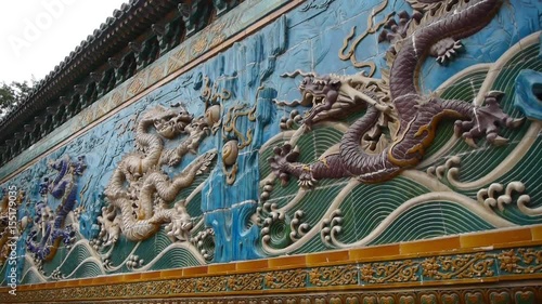 china royal nine dragon wall,stone dragon totem in forbidden city. photo