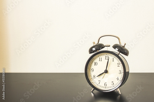 Alarm clock on Black table.