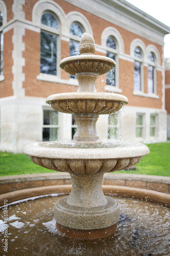 Three Tiered Water Fountain with Wishing Pond in Front of Historic old Building