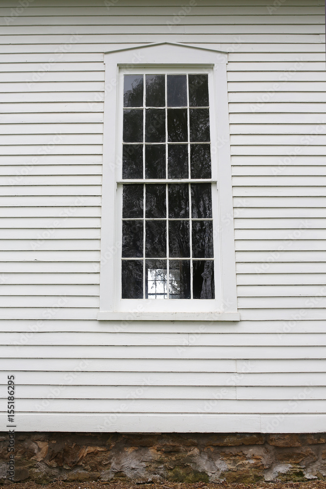 Old Grilled Window Pains and Wood Siding on Historic Little White Church
