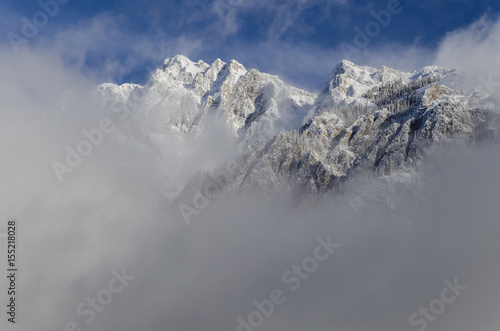 Mountain peaks emerging from the fog. Banff National Park, Alberta, Canada © Dee Cresswell