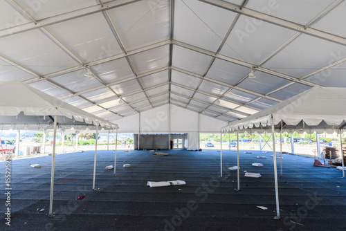 Inside large white tent for entertaining in field