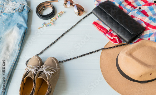 Accessories costume clothes Jeans and hats sunglasses shoes on a white background.