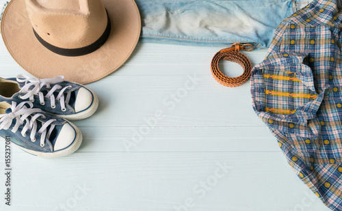 Accessories costume clothes Jeans and hats sunglasses shoes on a white background.