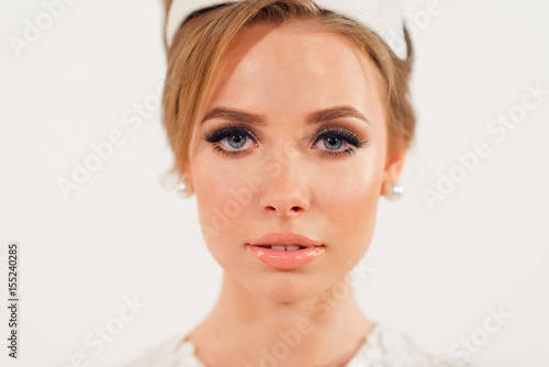 Portrait of the young woman with make up looking at camera
