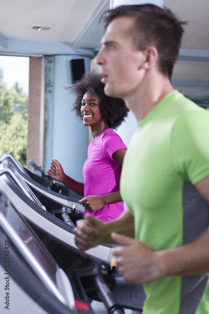 people exercisinng a cardio on treadmill in gym people exercisinng a cardio on treadmill in gym