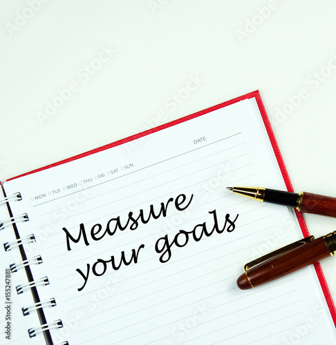 Wallpaper Mural Communication message motivation concept with " measure your goals " word on notebook. Torontodigital.ca