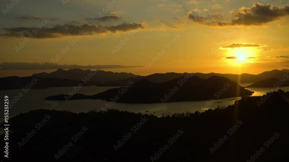 Marine tropical sunset over the sea, tropical island, sea bay and lagoon, mountains. Sunset over the sea in the background orange sky and islands. Travel concept. Beautiful serene scene. Coron Marine tropical sunset over the sea, tropical island, sea bay and lagoon, mountains. Sunset over the sea in the background orange sky and islands. Travel concept. Beautiful serene scene. Coron