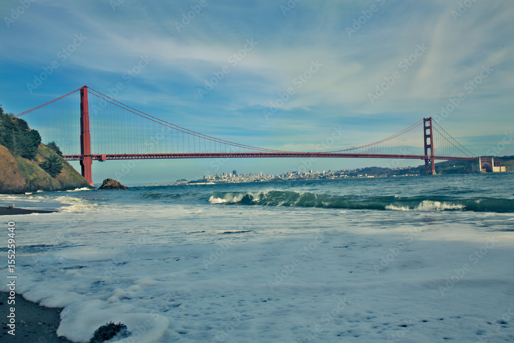 San Francisco from Kirby Cove, where you can view the city skyline underneath the span of the landmark Golden Gate Bridge San Francisco from Kirby Cove, where you can view the city skyline underneath the span of the landmark Golden Gate Bridge