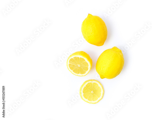 Fotografie, Obraz Closeup top view fresh lemon fruit and slice on white background