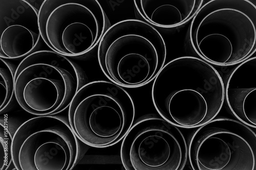 PVC pipes stacked in warehouse ,water