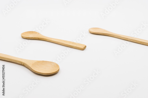 Wooden spoon over white background.