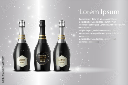 Three champagne wine bottles on sparkling background