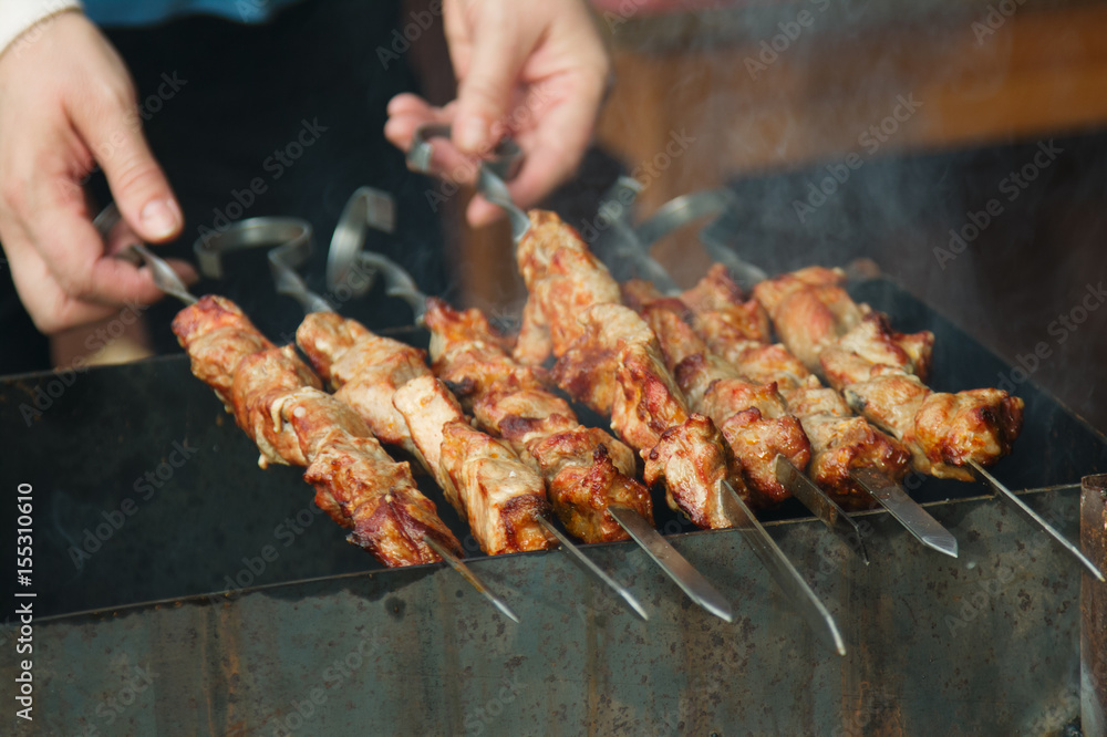 Cooked meat on skewers.