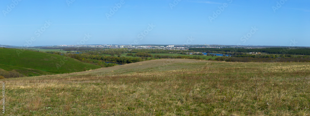 Panoramic landscape. View from the hills to the city outskirts.