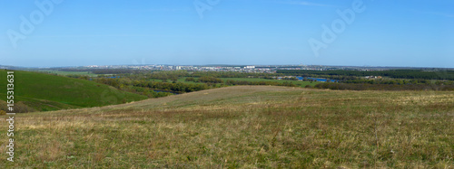 Panoramic landscape. View from the hills to the city outskirts.
