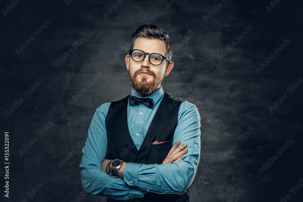 Successful bearded male with crossed arms, dressed in elegant shirt and waistcoat. Successful bearded male with crossed arms, dressed in elegant shirt and waistcoat.