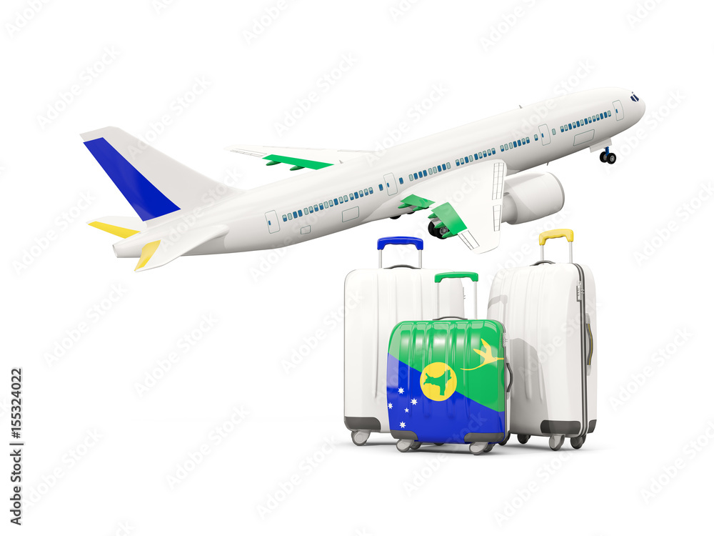 Luggage with flag of christmas island. Three bags with airplane