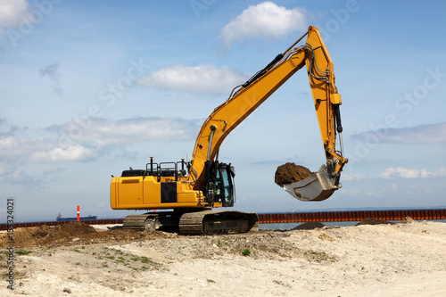 Wallpaper Mural Excavator works on a construction site with excavation Torontodigital.ca