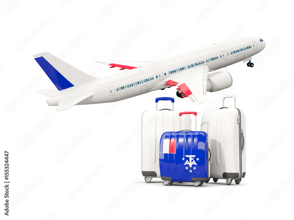 Luggage with flag of french southern territories. Three bags with airplane