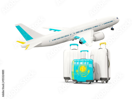 Luggage with flag of kazakhstan. Three bags with airplane © Mikhail Mishchenko