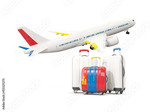 Luggage with flag of mongolia. Three bags with airplane © Mikhail Mishchenko