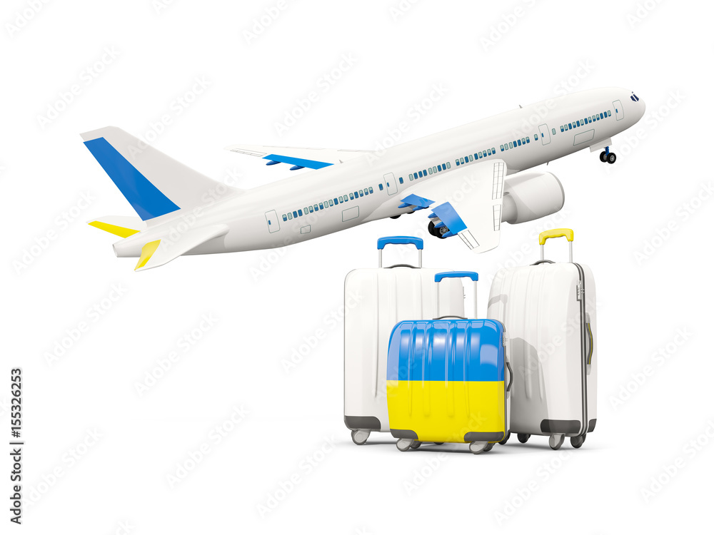 Luggage with flag of ukraine. Three bags with airplane