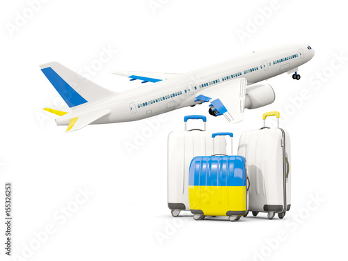 Luggage with flag of ukraine. Three bags with airplane © Mikhail Mishchenko