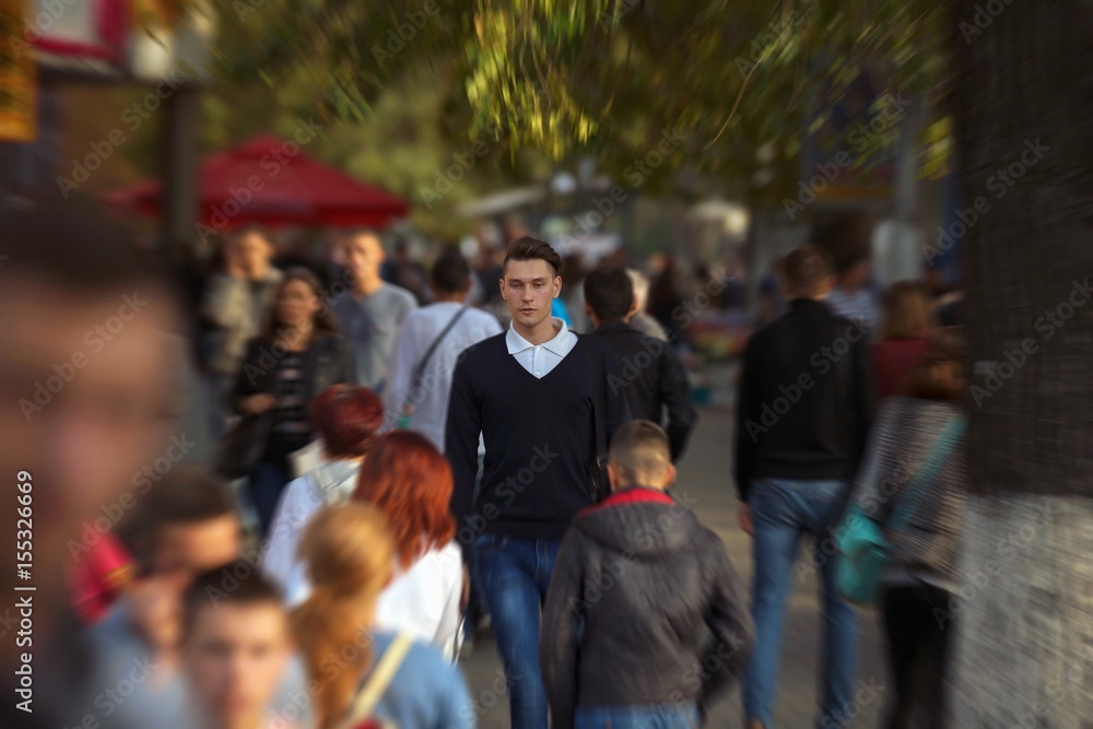 Hipster guy walking down the street, urban style Hipster guy walking down the street, urban style
