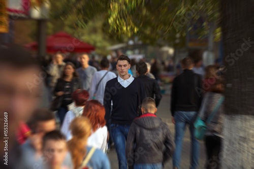 Hipster guy walking down the street, urban style